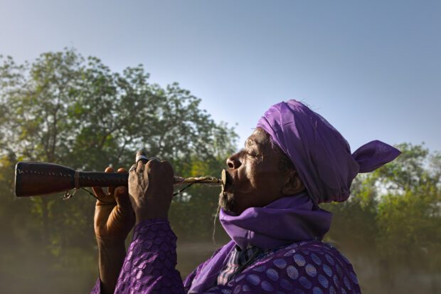 Man Playing Algaita at Argungu Durbar, Nigeria | Irene Becker Photography | Irene Becker Photography Argungu Durbar A man plays the algaita, a traditional Northern Nigerian wind instrument, at the Argungu Durbar festival.