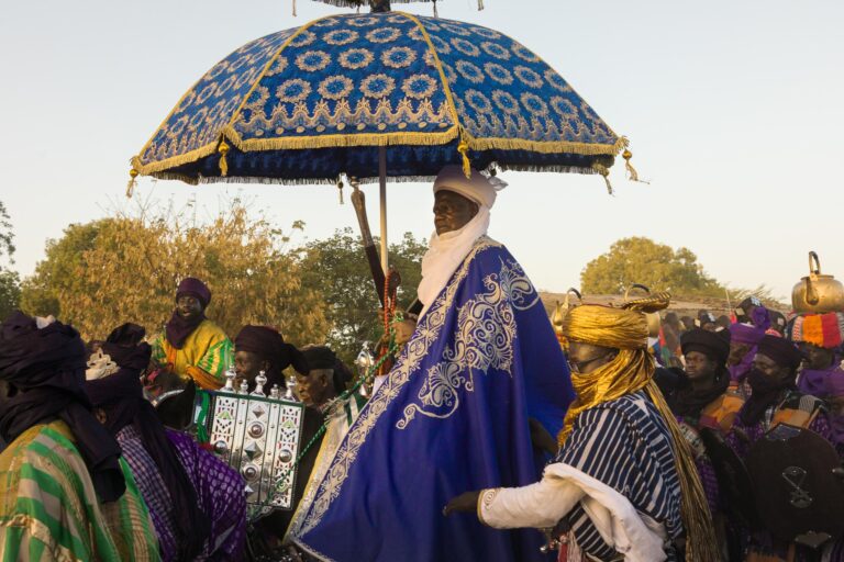 Argungu Durbar HRH Emir Samaila Mera on horseback with his entourage during the Argungu Durbar procession in Nigeria.